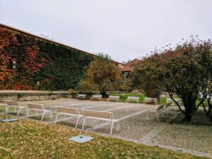 Garden of the monastery with its banches and trees. Looks very tranquil.