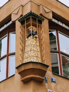 Little statue of Black Madonna on the exterior of the house