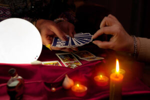 On this picture one client is picking the cards from the gypsy cards deck. It is during Prague fortunetelling class.