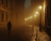 Foggy night street in Prague with a lone figure walking — atmospheric scene reflecting the city’s dark communist history