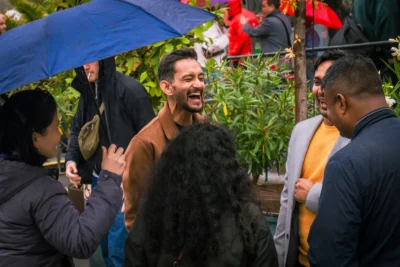 Corporate group enjoying a relaxed moment outdoors in Prague between venues, showing the ease and energy of a real MICE Prague experience