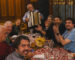Corporate group enjoying a traditional dinner with live music in Prague during an incentive MICE event