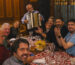 Corporate group enjoying a traditional dinner with live music in Prague during an incentive MICE event